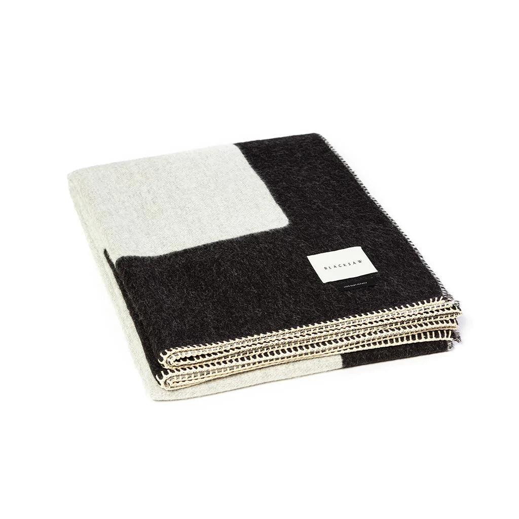 BLACKSAW TEXTILES - Generation Reversible Throw - Black/Ivory